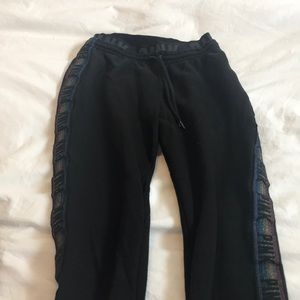 Women’s black joggers with rainbow strip